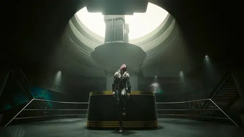 The protagonist of Cyberpunk 2077 stood at a desk in Phantom Liberty.