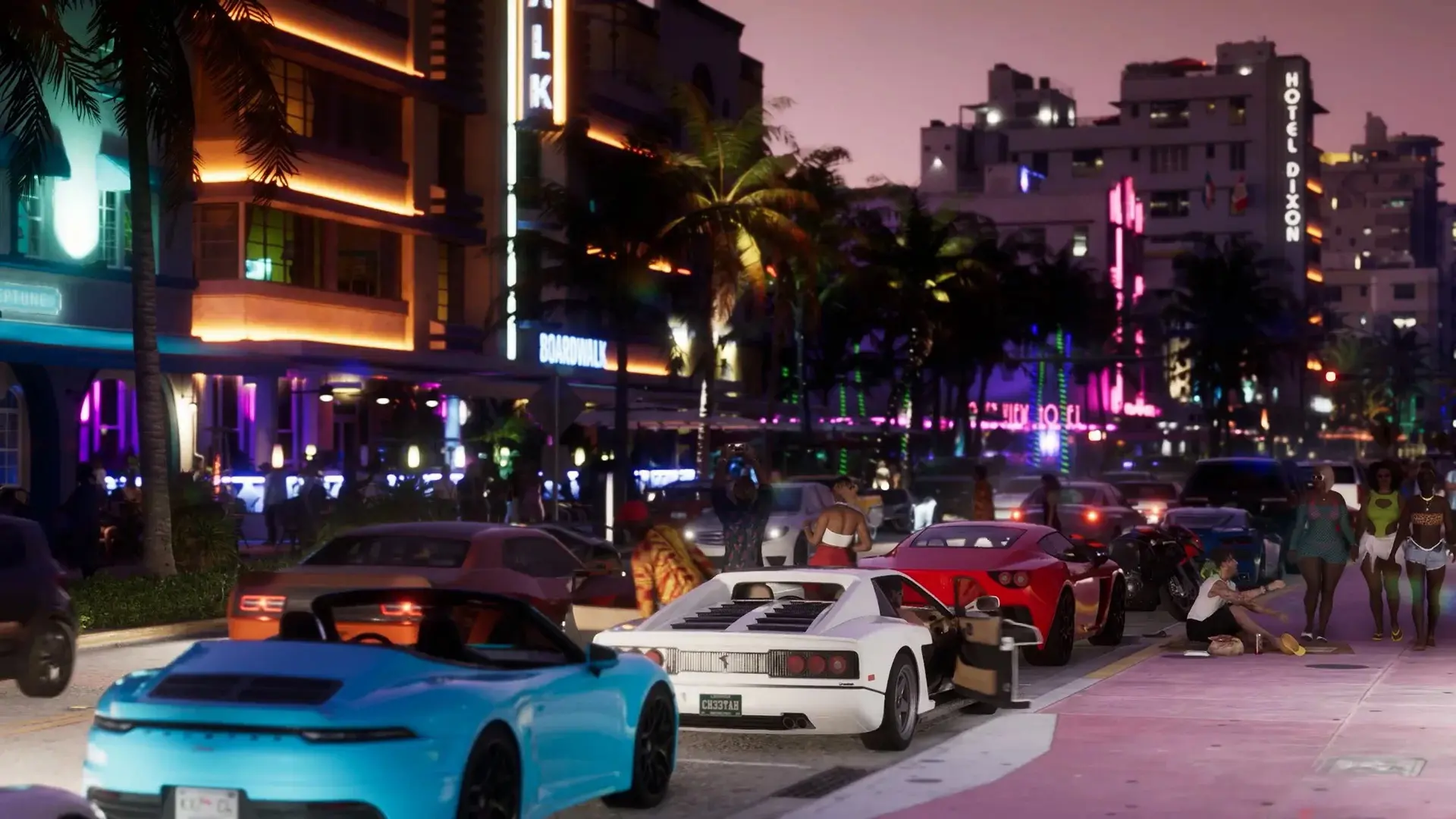 A strip of night clubs with a street awash with sports cars in Vice City, in the GTA VI trailer.