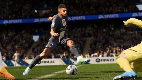 Key art for FIFA 23 of Kylian Mbappe doing a trivela shot