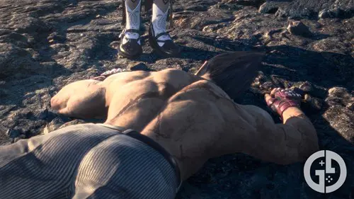 Kazuya lying unconscious after the final battle, as Jun approaches him