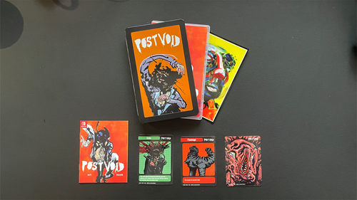 A look at the package included in Super Rare Games' Post Void Steenbok collection - the steenbok, the game box, a postcard, an art book, and a collection of trading cards.